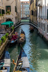 Fototapeta na wymiar Italy, Venice, Venice, HIGH ANGLE VIEW OF BOATS IN CANAL AMIDST BUILDINGS