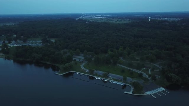 Aerial, roads at edge of lake in Milford, Michigan park