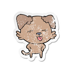 distressed sticker of a cartoon dog sticking out tongue
