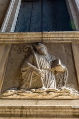Italy, Venice, a person lying on top of a building