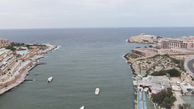 Aerial, buildings along shore in Malta
