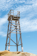 Fototapeta na wymiar Old wooden Shark watch beach tower