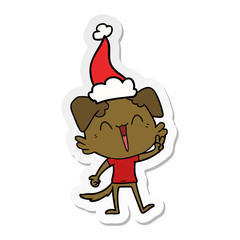 happy little dog sticker cartoon of a wearing santa hat