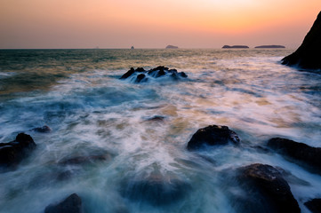 The landscape of coast sunrise of Dalian Bay, China.