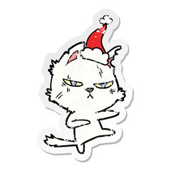 tough distressed sticker cartoon of a cat wearing santa hat