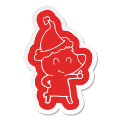 female bear cartoon  sticker of a wearing santa hat
