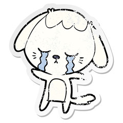 distressed sticker of a cartoon crying dog
