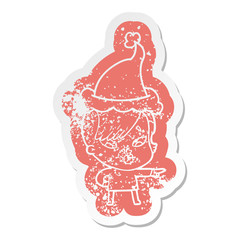cartoon distressed sticker of a surprised girl pointing wearing santa hat