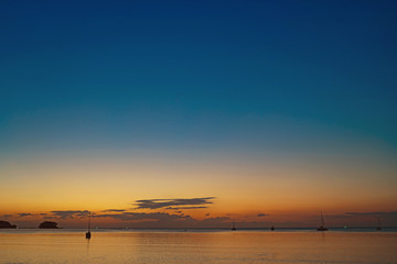 Background sky sunset,love travel to the beach orange tone,Bright in Phuket Thailand,Blue light moment.