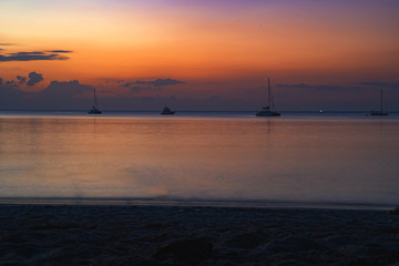 Background sky sunset,Silhouette Thai boat love travel to the beach adventure,Bright in Phuket Thailand.