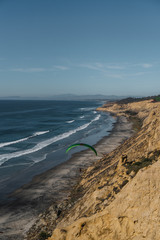 paraglider and cliffs