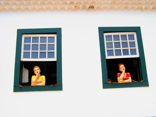 Traditional brazilian souvenir girl at the country house window in Ouro Preto Minas Gerais