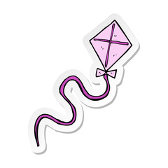 sticker of a cartoon flying kite