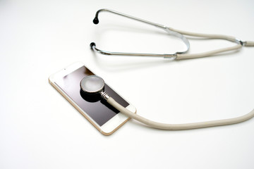 Fototapeta na wymiar Phone with stethoscope