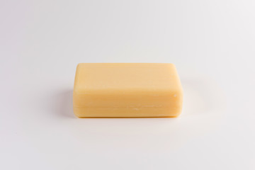 piece of beige soap isolated on a white background
