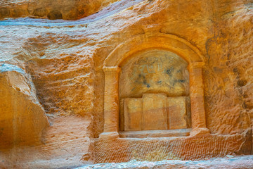 Stone carving on the wall of siq canyon in Petra, Jordan