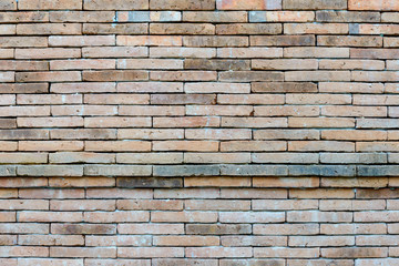 Fade mix various colour of red, brown, orange and yellow brick wall texture with running bond pattern.