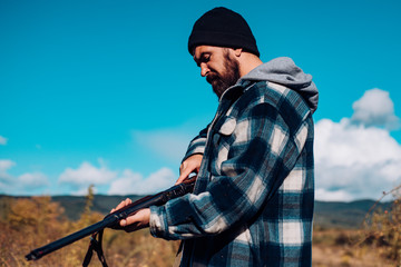 Hunter spend leisure hunting. Hunting equipment for professionals. Hunting is brutal masculine...