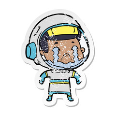 Obraz premium distressed sticker of a cartoon crying astronaut