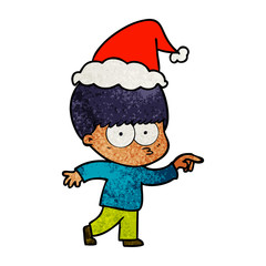 nervous textured cartoon of a boy wearing santa hat
