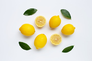 Lemon and slices with leaves isolated on white.