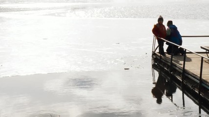 the beginning of spring. children play near the water.