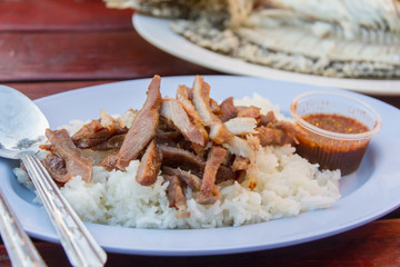pork grill on rice with spicy sauce,Thai food style