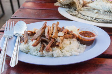 pork grill on rice with spicy sauce,Thai food style