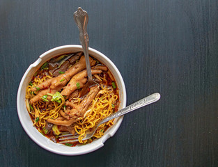 Braised chicken soup with bitter gourd noodle. Chicken gourd noodles with chicken leg, Thai food....