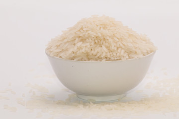 Jasmine rice in the white bowl in isolate white background.