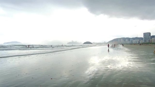 Silhoutte of a big sandy beach on a cloudy day  