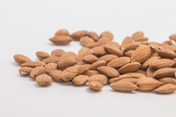 Raw natural organic close up Almonds on isolate white background.Close up Almond seeds.