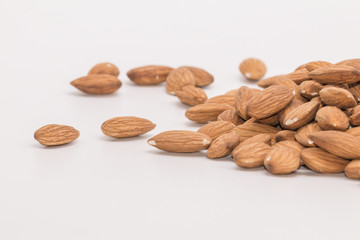 Raw natural organic Almonds on isolate white background.
