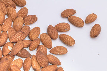 Raw natural organic Almonds on isolate white background.