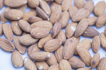 Raw natural organic close up Almonds on isolate white background.Close up Almond seeds.