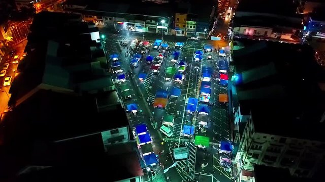 Top Night Aerial View of a night Market in the city of Kota Kinabalu - Malaysia - Front Dolly 