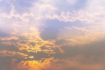 Blue sky with white clouds, the sun rises.