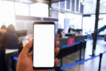 Woman holding smart phone with bank moblie can be add your texts or others. at coffee shop