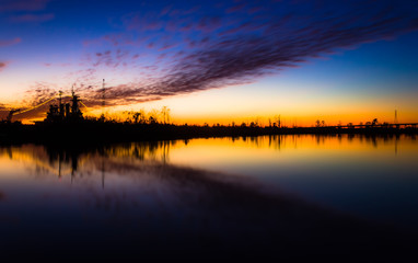 Sunsetting behind ship