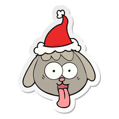 sticker cartoon of a dog face panting wearing santa hat