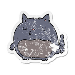 distressed sticker of a cartoon cat