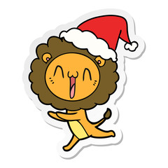 happy sticker cartoon of a lion wearing santa hat