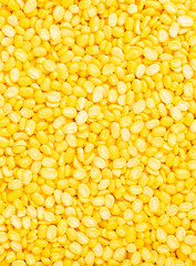 yellow split mung dal or moong dal pile isolated on white background 