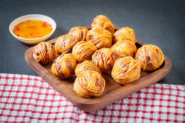 Deep Fried Wrapped Pork with Chinese Noodle Traditional Thai food.Thai traditional snacks menu ( Thai name is Moo sarong)