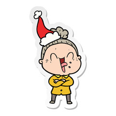 sticker cartoon of a happy old woman wearing santa hat