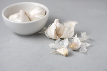 Garlic Bulbs with Garlic Clove on Gray Counter