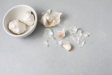 Garlic Bulbs with Garlic Clove on Gray Counter