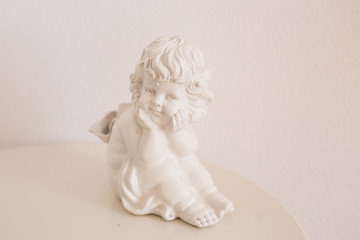figurine and interior concept - white ceramic angel