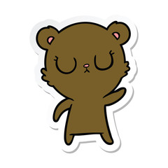 sticker of a peaceful cartoon bear