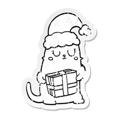 distressed sticker of a cute cartoon christmas cat
